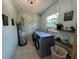 Bright laundry room with updated washer and dryer and storage at 3300 58Th N St, St Petersburg, FL 33710