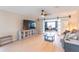 Spacious living room featuring a modern entertainment center and stylish barn doors at 3300 58Th N St, St Petersburg, FL 33710