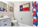 Clean and modern bathroom with vanity and Texas-themed decor at 3304 Latania Dr, Tampa, FL 33618