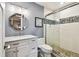 Modern bathroom features a vanity with marble countertop and a glass enclosed shower at 3304 Latania Dr, Tampa, FL 33618