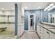 Elegant bathroom features dual vanities, granite countertops, and a glass-enclosed shower at 3304 Latania Dr, Tampa, FL 33618