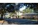 Community clubhouse with lush landscape, well manicured lawn, and charming architectural details providing a welcome venue for events at 3304 Latania Dr, Tampa, FL 33618