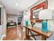 Hallway featuring hardwood floors, decorative console table with lamps, and stylish furnishings at 3304 Latania Dr, Tampa, FL 33618