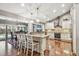 Spacious kitchen featuring granite countertops, stainless steel appliances, and a large island with bar seating at 3304 Latania Dr, Tampa, FL 33618