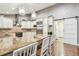 Bright kitchen with large center island, stainless steel appliances, and hardwood floors at 3304 Latania Dr, Tampa, FL 33618
