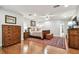 Spacious main bedroom with hardwood floors, craftsman details, and decorative area rug at 3304 Latania Dr, Tampa, FL 33618