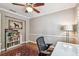 Home office with modern desk, hardwood floors, and a 'Labrador Lake' poster at 3304 Latania Dr, Tampa, FL 33618