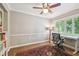 Bright office space featuring hardwood floors, shutters, and a traditional rug at 3304 Latania Dr, Tampa, FL 33618