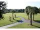 Scenic community park with walking paths, mature trees, and lush green lawns, perfect for outdoor activities and relaxation at 3304 Latania Dr, Tampa, FL 33618