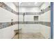 Nicely tiled walk-in shower with dual shower heads and a built-in corner seat at 3304 Latania Dr, Tampa, FL 33618