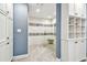 Modern walk-in shower with decorative tile accents, built-in bench and storage at 3304 Latania Dr, Tampa, FL 33618