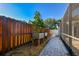 Side yard featuring a well-maintained brick paver path, raised garden beds, and a privacy fence at 3304 Latania Dr, Tampa, FL 33618