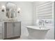 Bright bathroom featuring a standalone tub and elegant fixtures at 3619 W Leona St, Tampa, FL 33629