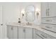 Well-lit bathroom with stylish cabinets and marble countertops at 3619 W Leona St, Tampa, FL 33629