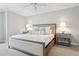 Calm bedroom featuring neutral tones and stylish bedside tables at 3619 W Leona St, Tampa, FL 33629