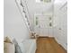 Bright foyer with hardwood floors, a staircase, and an entryway with transom windows at 3619 W Leona St, Tampa, FL 33629