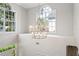 Bright foyer with large windows and a decorative chandelier at 3619 W Leona St, Tampa, FL 33629