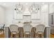 Modern kitchen features a center island with barstool seating and elegant pendant lighting at 3619 W Leona St, Tampa, FL 33629