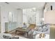 Spacious living area with elegant decor, hardwood floors, and a view of the staircase at 3619 W Leona St, Tampa, FL 33629