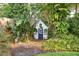 Charming backyard playhouse surrounded by tropical landscaping at 3619 W Leona St, Tampa, FL 33629