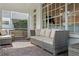 Spacious screened porch featuring brick flooring and comfortable wicker seating at 3619 W Leona St, Tampa, FL 33629