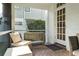 Inviting screened porch with brick flooring, comfortable seating and tranquil backyard view at 3619 W Leona St, Tampa, FL 33629