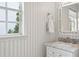 Bright powder room with marble countertop and elegant fixtures at 3619 W Leona St, Tampa, FL 33629