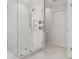 Modern shower with glass doors and white subway tile at 3619 W Leona St, Tampa, FL 33629