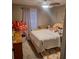 Cozy bedroom with ceiling fan, area rug and window with natural light creating a relaxing atmosphere at 37535 Laurel Hammock Dr, Zephyrhills, FL 33541