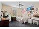 Cozy bedroom with a window and stylish decor, offering a comfortable and personalized living space at 396 Winthrop Dr, Spring Hill, FL 34609