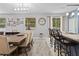 Bright dining area with modern chandelier, lots of natural light, and seating for eight at 396 Winthrop Dr, Spring Hill, FL 34609