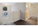 Hallway with carpet and artwork on the wall, leading to a bathroom and other rooms at 396 Winthrop Dr, Spring Hill, FL 34609