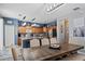 Open kitchen and dining area featuring a large island, modern lighting, and stainless appliances at 396 Winthrop Dr, Spring Hill, FL 34609