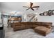 Open concept living space with hardwood floors, lots of natural light, and a modern color palette at 396 Winthrop Dr, Spring Hill, FL 34609