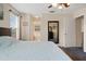 Bright primary bedroom featuring ensuite bathroom access, lots of natural light, and carpet floors at 396 Winthrop Dr, Spring Hill, FL 34609