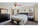 Comfortable primary bedroom featuring neutral tones, ample natural light, and carpet floors at 396 Winthrop Dr, Spring Hill, FL 34609