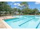 Community swimming pool with crisp blue water and surrounding lounge chairs at 396 Winthrop Dr, Spring Hill, FL 34609