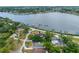 Overhead shot of house shows well-maintained lawn, nice landscaping, and great location near the water and other neighborhood homes at 401 Whitcomb Blvd, Tarpon Springs, FL 34689