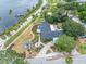 Beautiful aerial shot showcases the home's lush landscaping, water access, and relaxing outdoor spaces at 401 Whitcomb Blvd, Tarpon Springs, FL 34689