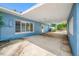 Spacious carport area attached to a charming home, offering covered parking at 401 Whitcomb Blvd, Tarpon Springs, FL 34689