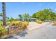 Charming single-story home featuring a well-maintained lawn and a long driveway at 401 Whitcomb Blvd, Tarpon Springs, FL 34689