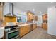 Modern kitchen featuring gas range, stainless steel appliances, and quartz countertops at 401 Whitcomb Blvd, Tarpon Springs, FL 34689