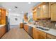 Spacious kitchen features modern appliances, tile backsplash, and ample counter space for cooking and entertaining at 401 Whitcomb Blvd, Tarpon Springs, FL 34689