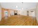 Expansive living room with hardwood floors, brick fireplace, and plenty of space for entertaining at 401 Whitcomb Blvd, Tarpon Springs, FL 34689