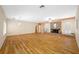 Large living room features a brick fireplace, hardwood floors, and bright, neutral walls at 401 Whitcomb Blvd, Tarpon Springs, FL 34689