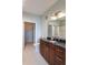 Bathroom boasts granite counters, wood cabinets, and a walk-in closet at 4221 W Spruce St # 1303, Tampa, FL 33607