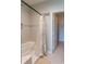 Bathroom featuring a shower-tub combo and walk-in closet at 4221 W Spruce St # 1303, Tampa, FL 33607