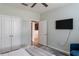 Bedroom features neutral walls, wood floors and a mounted TV at 4221 W Spruce St # 1303, Tampa, FL 33607