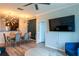 Open-concept living and dining area with modern lighting, and access to the kitchen with stainless steel appliances at 4221 W Spruce St # 1303, Tampa, FL 33607