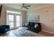Inviting living room with a comfortable sofa, stylish coffee table, and a door leading to a balcony at 4221 W Spruce St # 1303, Tampa, FL 33607